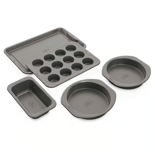 Five-piece bakeware set including two round cake pans, a muffin tray, a loaf pan, and a cookie sheet.