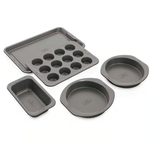 Five-piece bakeware set including two round cake pans, a muffin tray, a loaf pan, and a cookie sheet.