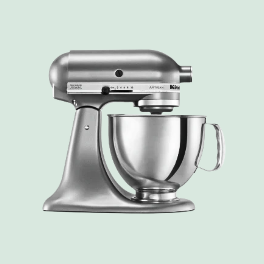 Silver stand mixer with a stainless steel mixing bowl and adjustable speed settings.
