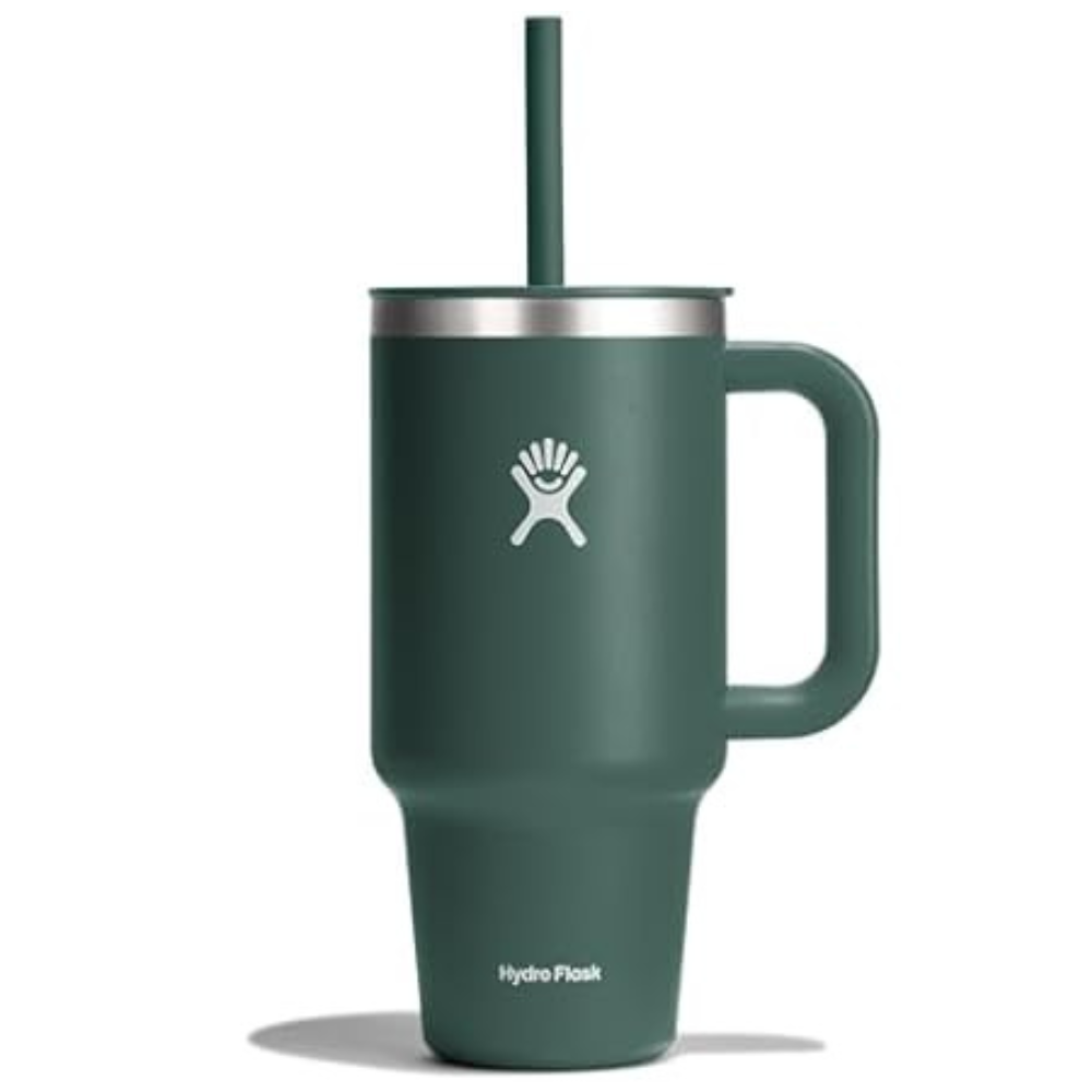 A green Hydro Flask mug with a handle and a straw, featuring a stainless steel lid and the brand's logo on the front.