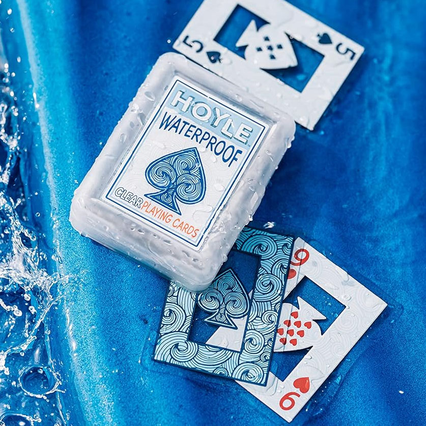 Hoyle Waterproof Clear Playing Cards are shown with some cards partially submerged in water, highlighting their durability and water resistance.