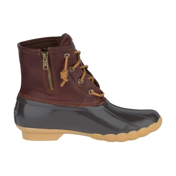 Sperry Saltwater Boots feature a waterproof, rubber lower shell with a brown leather upper, side zipper, and lace-up front. The sole is cushioned with a textured rubber outsole for traction.