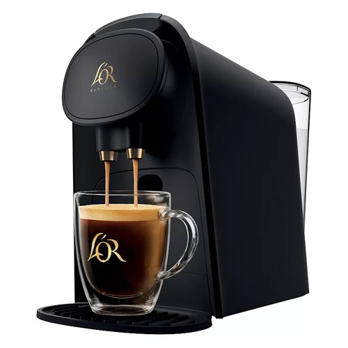 A black L'OR Barista coffee machine is shown with a glass mug filled with coffee, featuring the L'OR logo on both the machine and mug.
