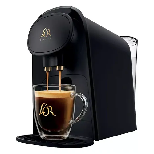 A black L'OR Barista coffee machine is shown with a glass mug filled with coffee, featuring the L'OR logo on both the machine and mug.