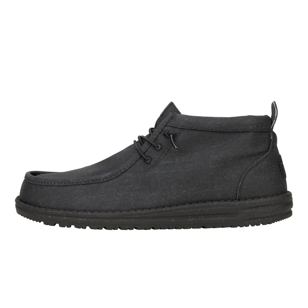 Black mid-top casual shoe with a moc toe, lace-up design, and a sturdy sole.