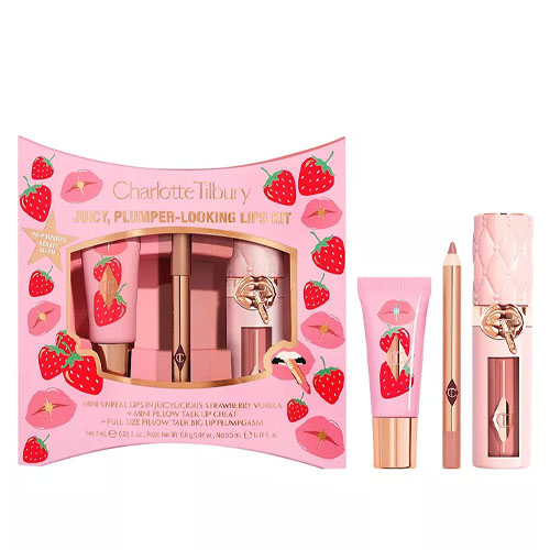 Charlotte Tilbury Juicy, Plumper-Looking Lips Kit includes a mini collagen lip bath, pillow talk lip cheat pencil, and a plump and glow lip gloss. The packaging is strawberry-themed.