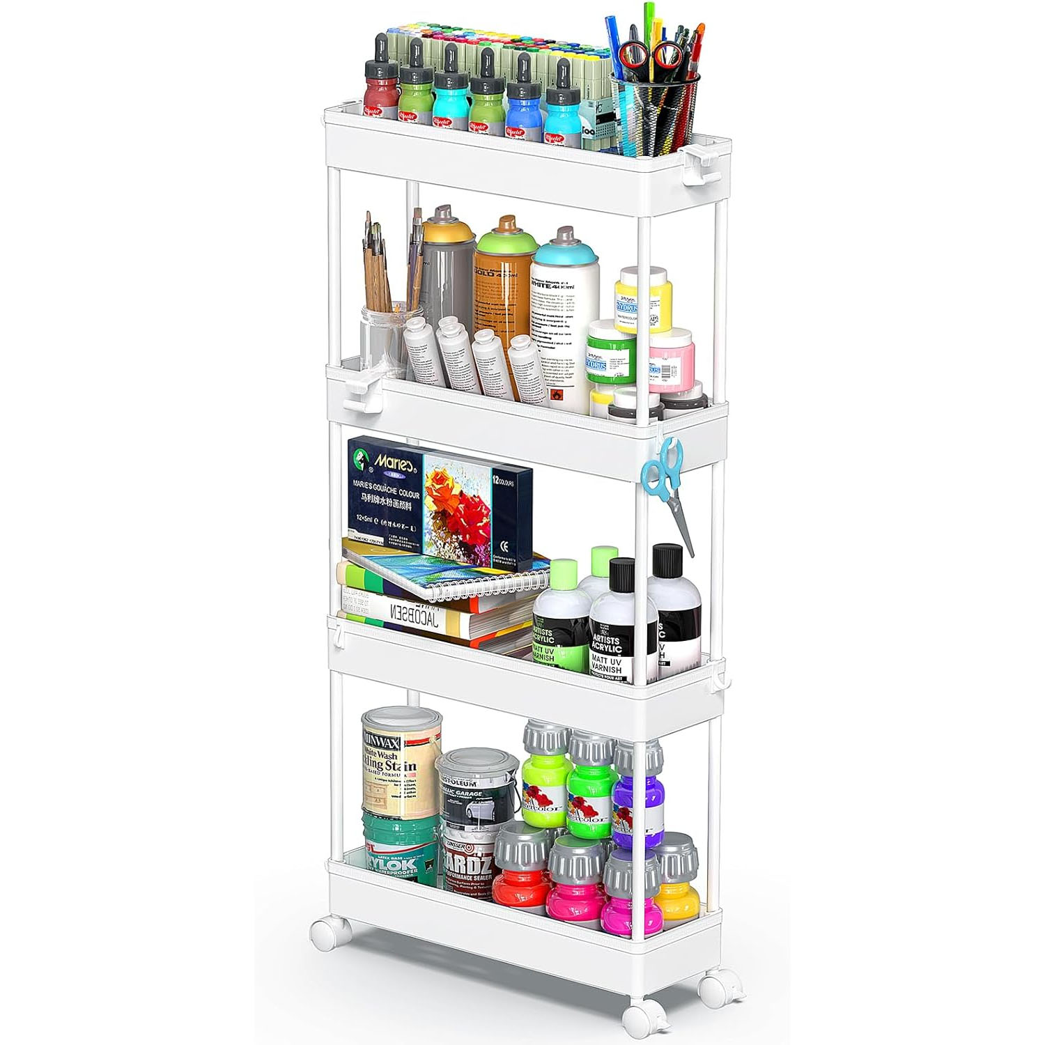 A four-tier rolling cart holds various art supplies including paint bottles, markers, scissors, brushes, and glue. Each tier contains items like spray paint, acrylics, watercolor sets, and art books.