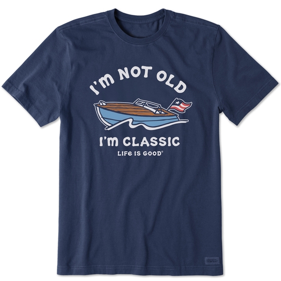 Navy blue T-shirt with a print of a boat and the text \“I'M NOT OLD, I'M CLASSIC, LIFE IS GOOD\“ in white letters.