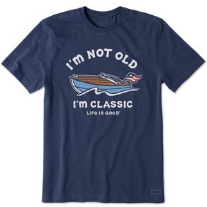 Navy blue T-shirt with a print of a boat and the text \“I'M NOT OLD, I'M CLASSIC, LIFE IS GOOD\“ in white letters.