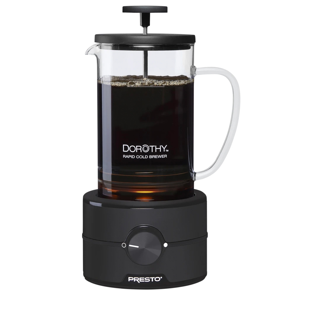 Presto Dorothy Rapid Cold Brewer features a glass carafe with a black handle and lid, equipped with a plunger mechanism and a black base with a central dial, designed for quickly brewing cold coffee.