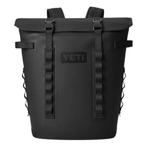 A black Yeti Hopper Cooler Backpack with a roll-top closure, sturdy straps, and daisy chain attachment points on the front. It features side netted pockets for additional storage.