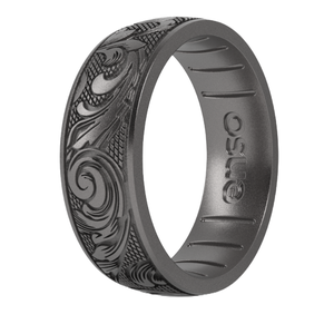 A dark-colored silicone ring with intricate etched designs featuring swirls and abstract patterns, branded with \“Enso\“ on the inner side.