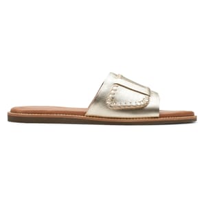 Gold metallic leather slide sandal with a stitched front strap and a flat sole, featuring a cushioned brown footbed.