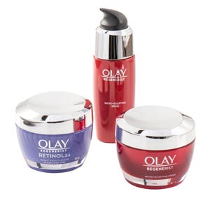 Olay Regenerist skincare products including a Micro-Sculpting Cream, Micro-Sculpting Serum, and Retinol 24 Night Moisturiser, all with silver lids and different colored containers.