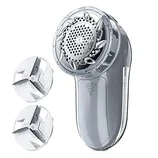 Electric fabric shaver with two replacement blades, designed for removing lint and fuzz from clothing and textiles.