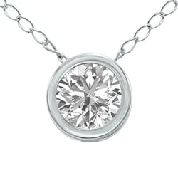 A silver necklace featuring a round-cut diamond set in a bezel setting with a chain of oval links.