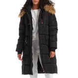 A woman is wearing a long black puffer coat with a faux fur-trimmed hood, over a white outfit.