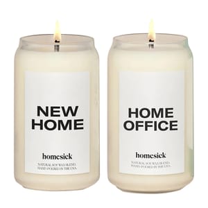 Two Homesick soy wax candles labeled \“New Home\“ and \“Home Office,\“ featuring natural soy wax blends hand-poured in the USA.