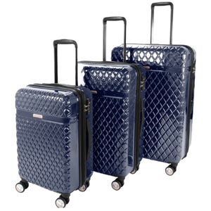 Three blue, hardside suitcases with a diamond texture design, featuring telescoping handles and multi-directional spinner wheels for mobility.