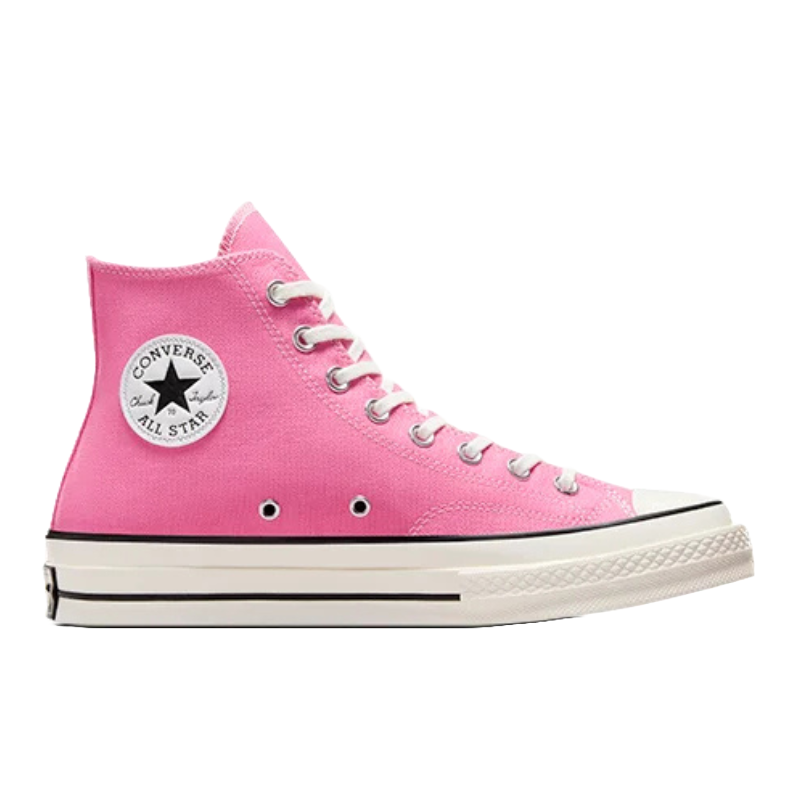 A pink Converse All Star high-top sneaker featuring white laces, a black-and-white logo patch, and a white rubber sole with black stripes.