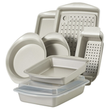Bakeware set including round, square, and rectangular pans, a pizza pan, and a perforated crisper, all with nonstick surfaces.
