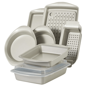 Bakeware set including round, square, and rectangular pans, a pizza pan, and a perforated crisper, all with nonstick surfaces.