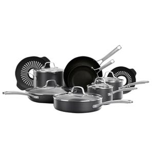 This is a collection of black Calphalon cookware featuring two frying pans, two sauté pans with lids, two saucepans with lids, a stockpot with a lid, and two black pan protectors.