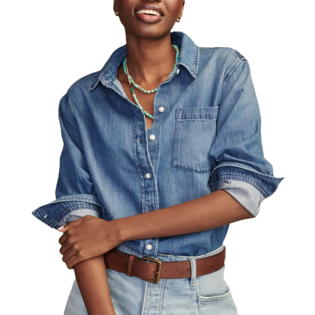 Denim Utility Shirt with a classic button-down design, single chest pocket, and rolled-up sleeves, made from medium-wash denim fabric. Styled with a brown belt and a turquoise beaded necklace for a casual look.