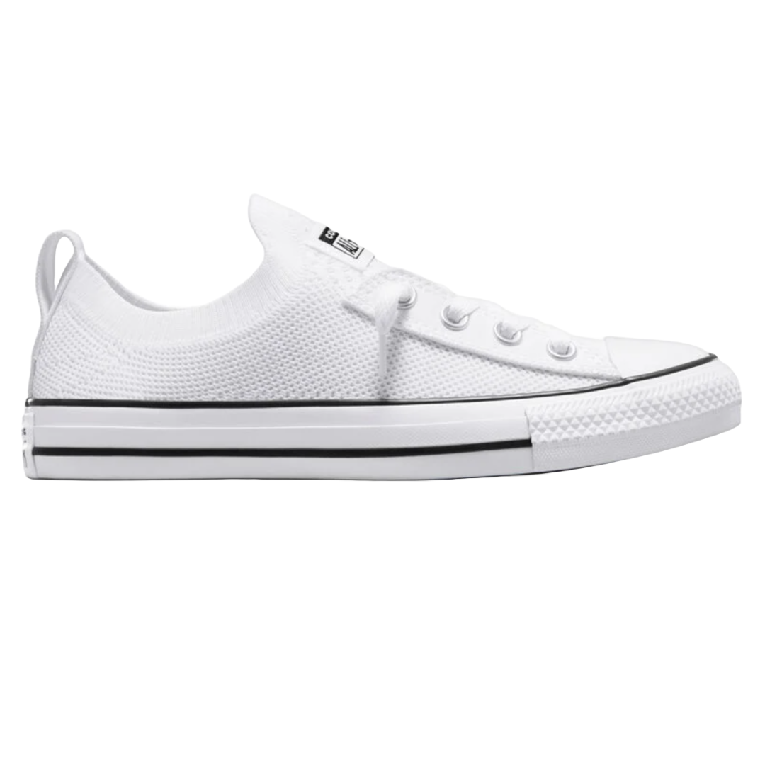 White low-top sneaker with a knit upper, lace-up design, rubber toe cap, and black stripe detailing on the sole.