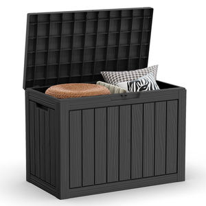 A black, 45-gallon deck box with an open lid showing storage space containing a round woven item and patterned cushions. It has a paneled design and integrated side handles.