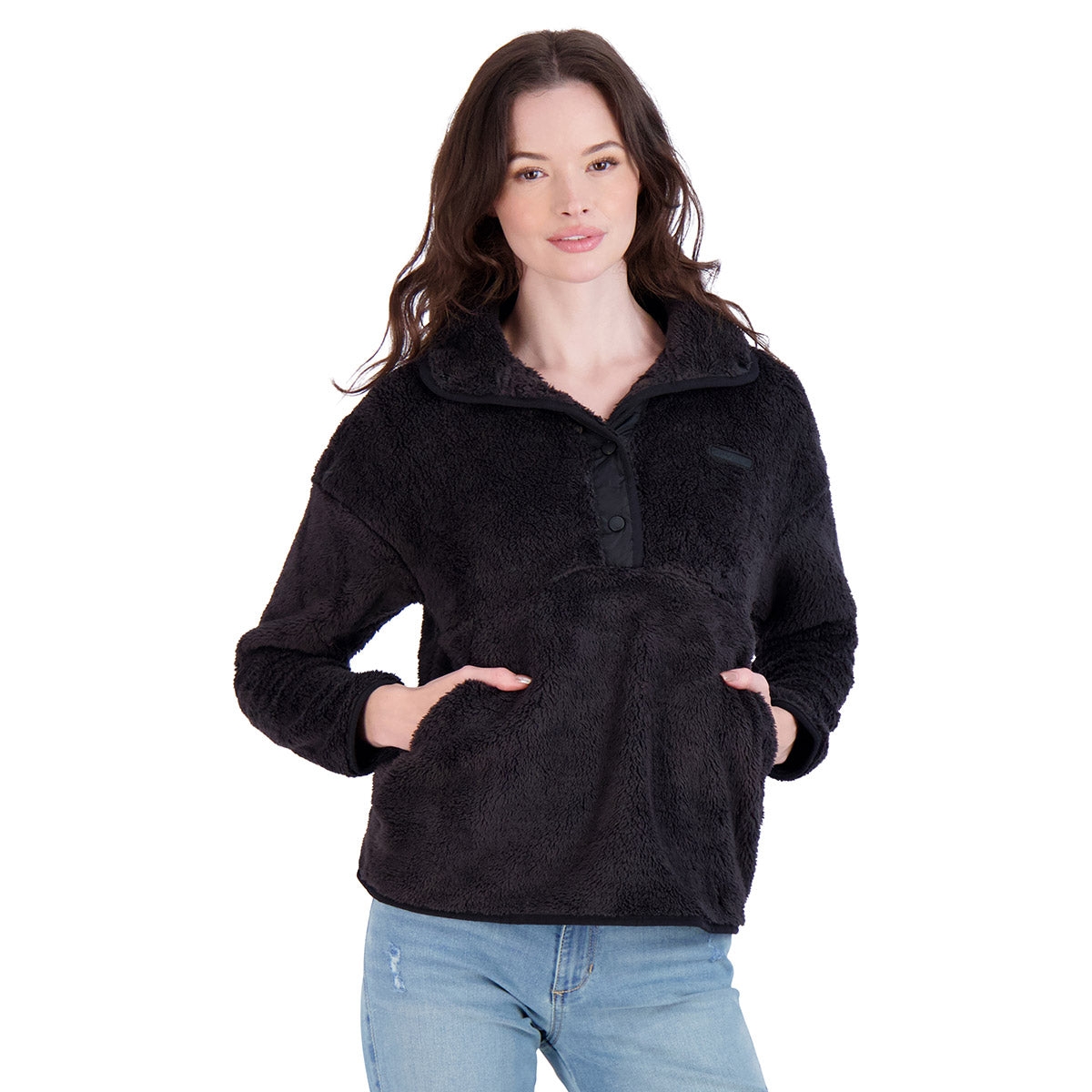 Black fuzzy pullover with a half-button front, high collar, and front kangaroo pocket, paired with light blue jeans.