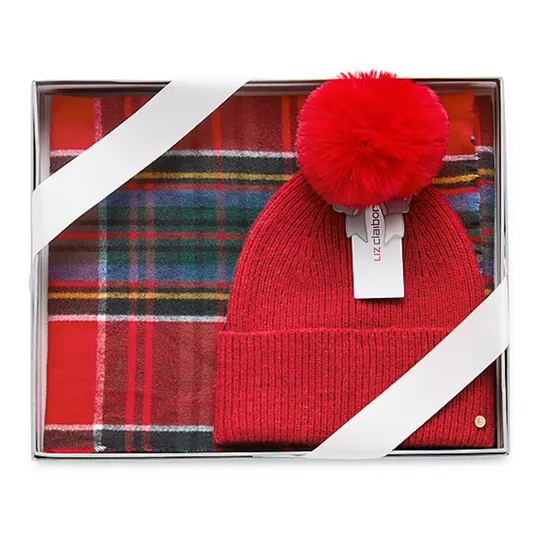 Red knit beanie with a pom-pom and a red plaid scarf, packaged in a gift box.