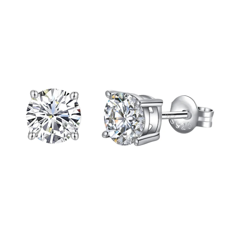 A pair of round-cut silver stud earrings with clear gemstones, set in four prong settings and featuring a 925 sterling silver marking on the back.