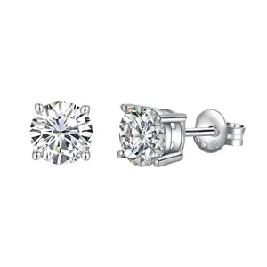 A pair of round-cut silver stud earrings with clear gemstones, set in four prong settings and featuring a 925 sterling silver marking on the back.