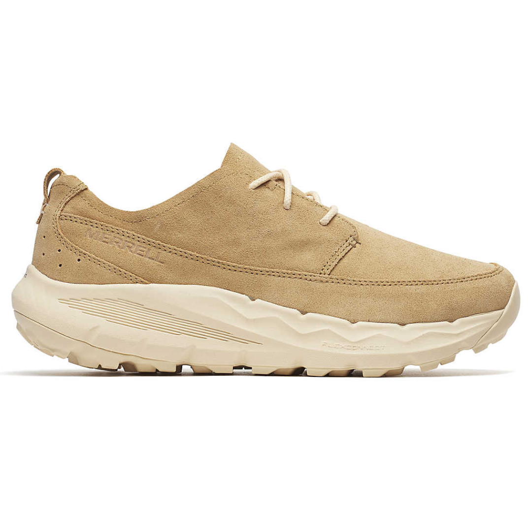 Tan suede sneaker with a chunky, light-colored sole and minimal stitching. Features a lace-up design and a pull tab at the heel.