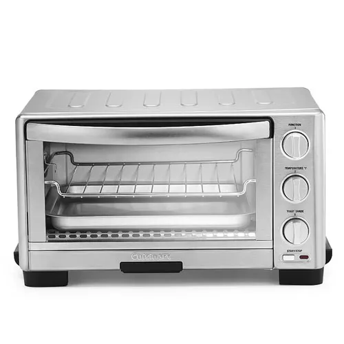 A compact stainless steel toaster oven with adjustable temperature, function, and timer dials, featuring a glass door and a wire rack inside.