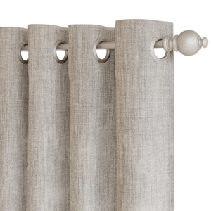 Light grey blackout curtain with a textured fabric and metal grommets, hung on a curtain rod with decorative end caps.