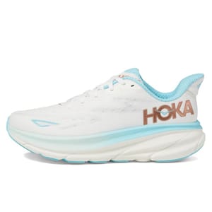 A white Hoka running shoe with light blue accents and the Hoka logo in brown on the side.