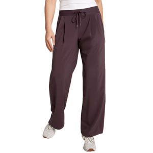 Dark brown drawstring pants paired with white sneakers.