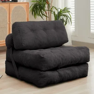 Convertible black corduroy futon chair that can be folded into different configurations, functioning as a chair or a bed.