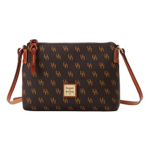 A Dooney & Bourke crossbody bag with a brown leather exterior featuring a monogram pattern of the initials \“DB,\“ a leather strap, and a front logo patch.