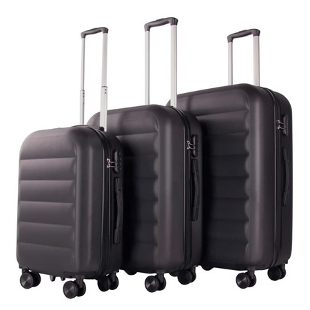 A set of three black hardside suitcases with telescopic handles and four spinner wheels each, featuring a sleek ribbed design. Sizes vary for different travel needs, offering practical and durable luggage options.