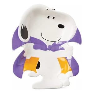 Ceramic dish shaped like a cartoon dog in a purple cape, holding yellow trick-or-treat bags.