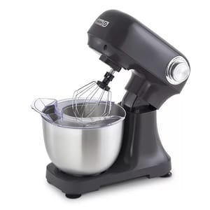 A Dash Tilt-Head Stand Mixer in dark gray features a stainless steel bowl and wire whisk attachment. It has a tilt-head design and a control knob on the side for adjusting settings.