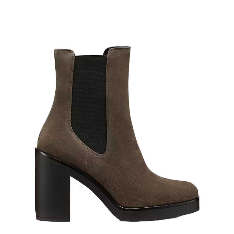 Bethenny Chelsea Booties feature taupe suede with a chunky black high heel and elastic side panels, offering a stylish yet functional design.