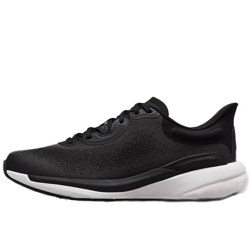 A black and white athletic shoe with a sleek design and cushioned sole.