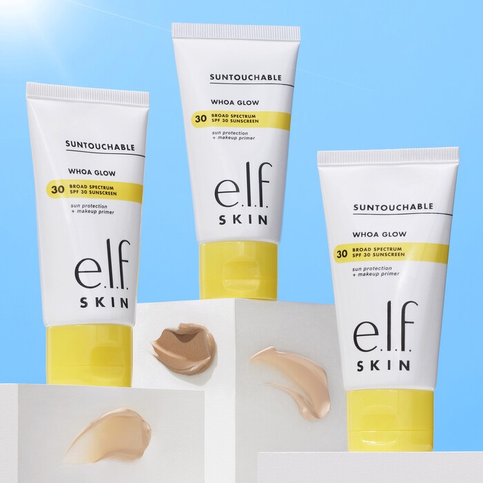 Three tubes of e.l.f. Skin Whoa Glow SPF 30 sunscreen and makeup primer, with swatches of the product shown separately.