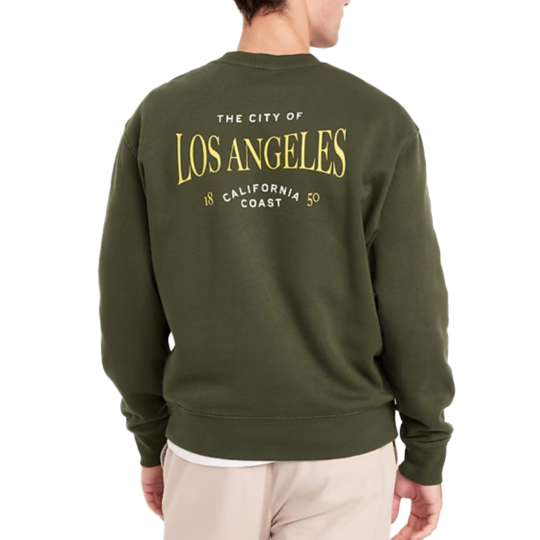A person is wearing a dark green sweatshirt with yellow text saying \“The City of Los Angeles, California Coast 1850\“ on the back.