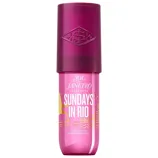 Sol de Janeiro Sundays in Rio Perfume Mist in a pink bottle with a dark pink cap, featuring yellow skyline graphics and text.