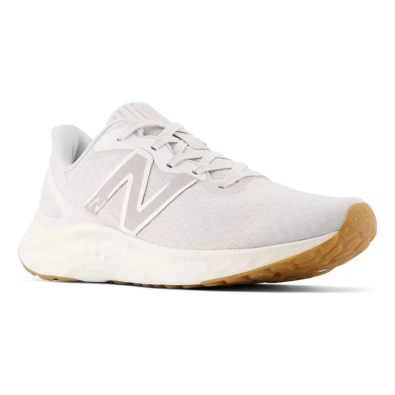 A light gray New Balance running shoe with a white midsole and gum-colored outsole, featuring the brand's logo on the side.